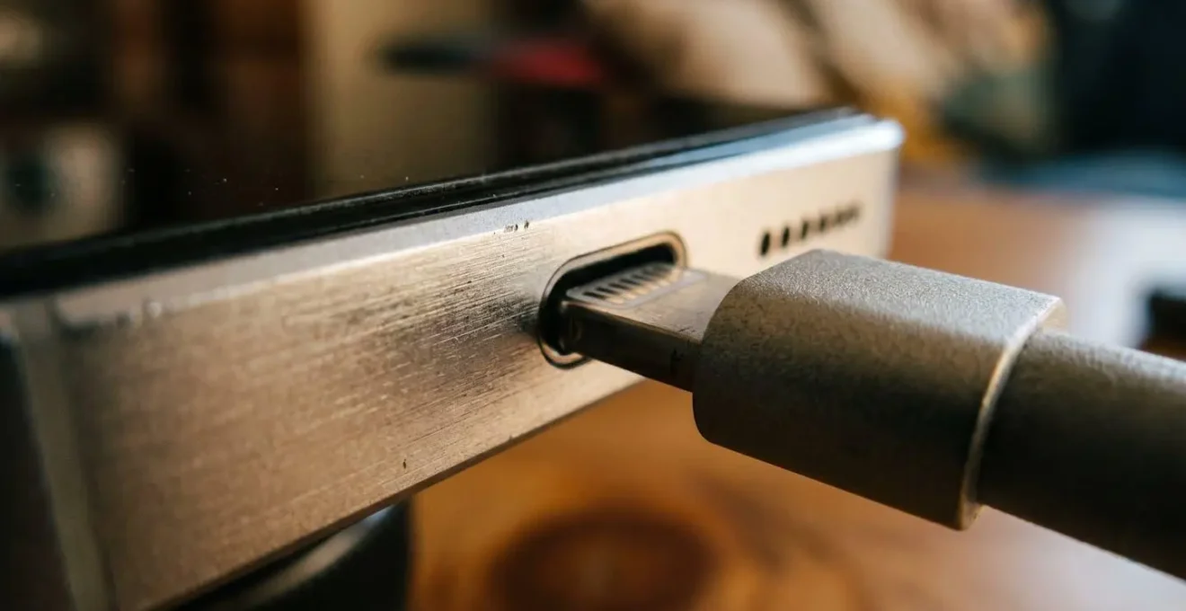 Close-up macro shot of smartphone battery indicator displaying charge level synchronization