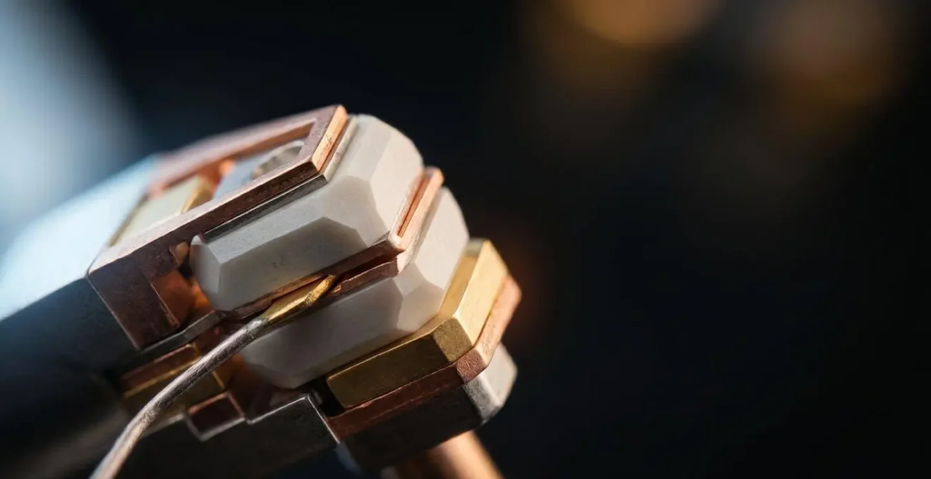 Close-up view of miniature piezoelectric haptic actuator components showing precision engineering and micro-scale technology