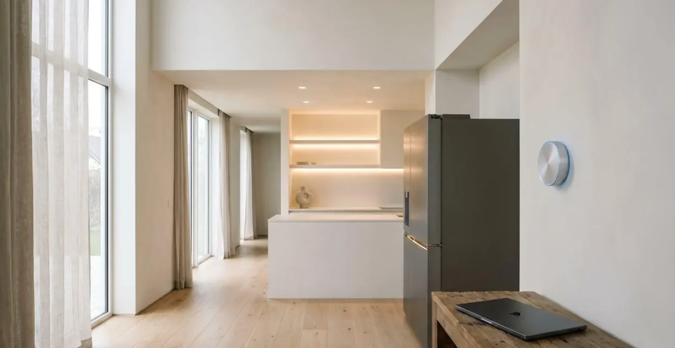 Modern smart home environment showing connected IoT devices in minimalist interior setting
